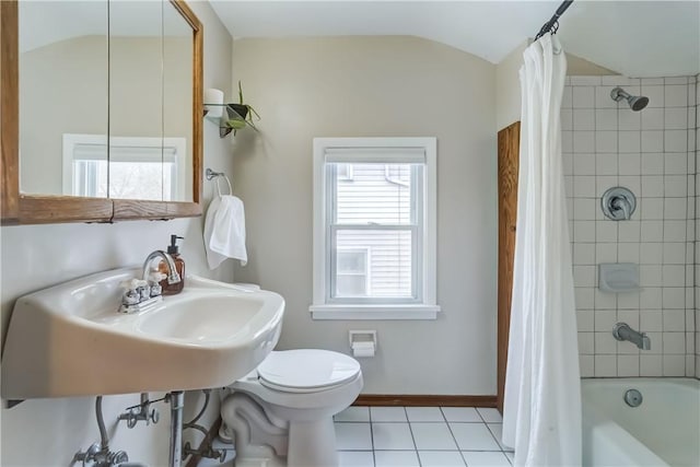 bathroom featuring toilet, tile patterned flooring, vaulted ceiling, and shower / bath combo