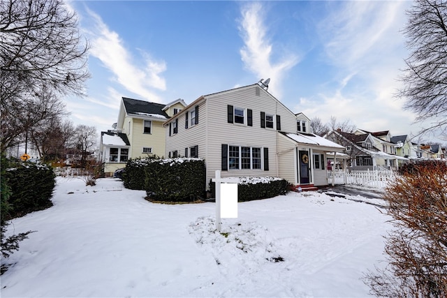 view of snow covered house