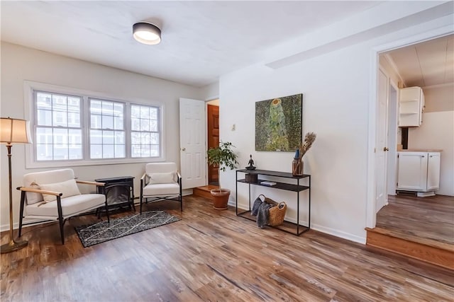 sitting room with hardwood / wood-style floors