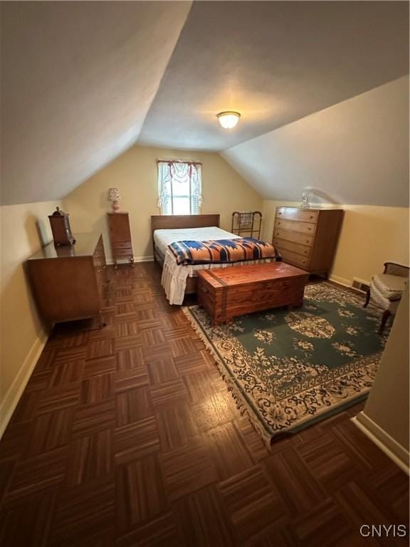 bedroom featuring vaulted ceiling