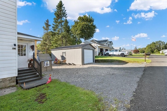 exterior space with an outbuilding and a garage