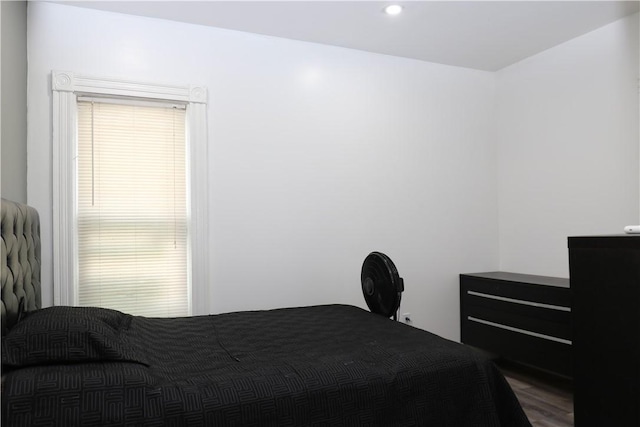 bedroom featuring dark hardwood / wood-style flooring