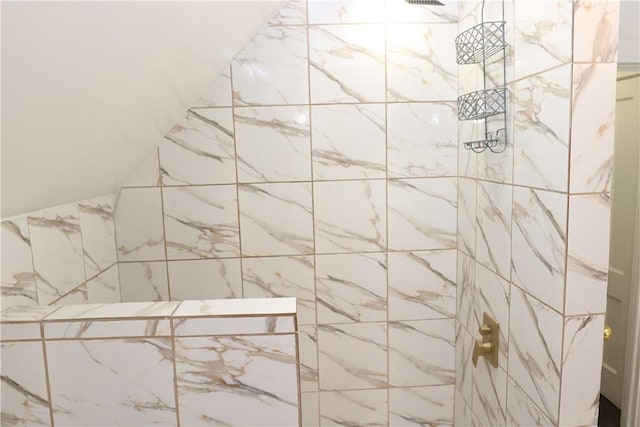 bathroom with a tile shower