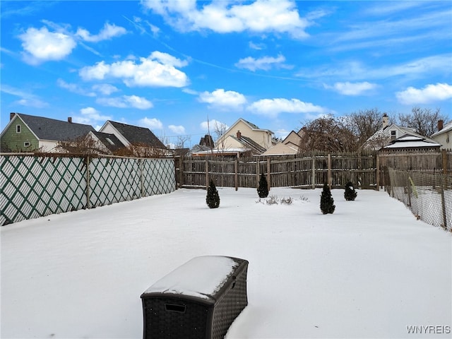 view of yard layered in snow