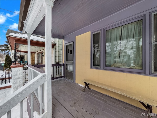 view of snow covered deck