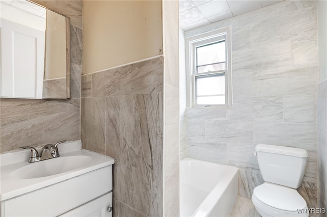 bathroom with toilet, tile walls, a tub to relax in, and vanity