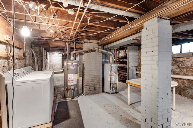 basement with washing machine and clothes dryer and gas water heater