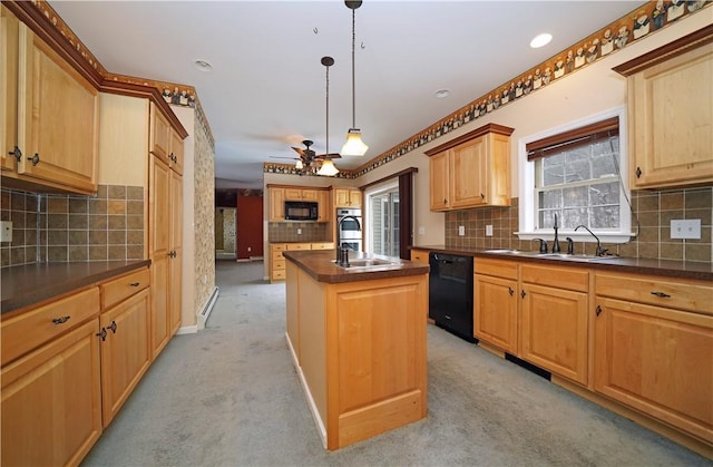 kitchen featuring decorative light fixtures, a kitchen island with sink, black appliances, and light carpet