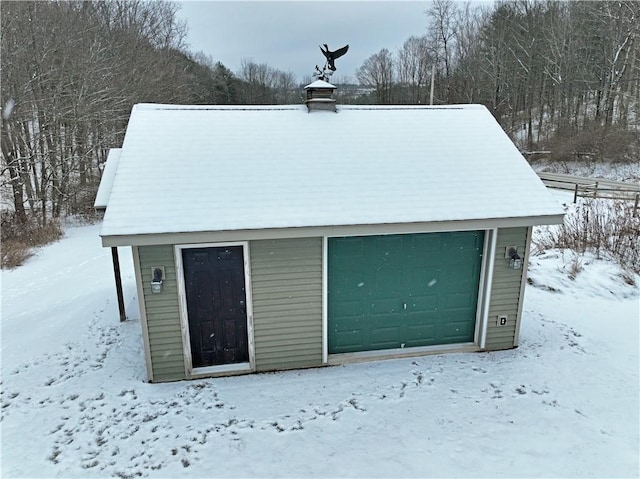 view of snow covered garage