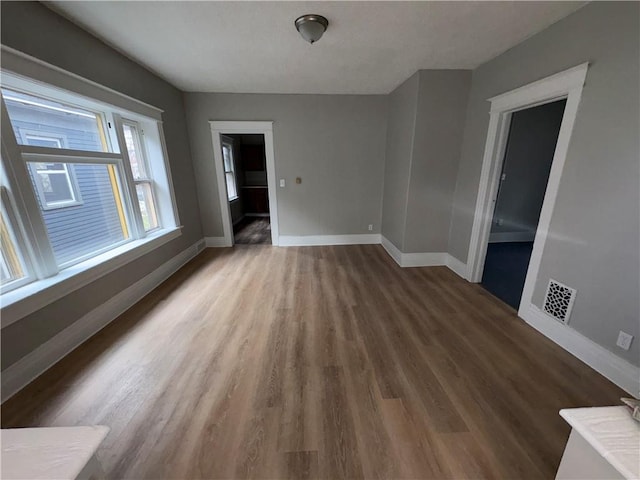 empty room featuring dark hardwood / wood-style floors