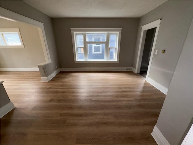 spare room with dark hardwood / wood-style flooring