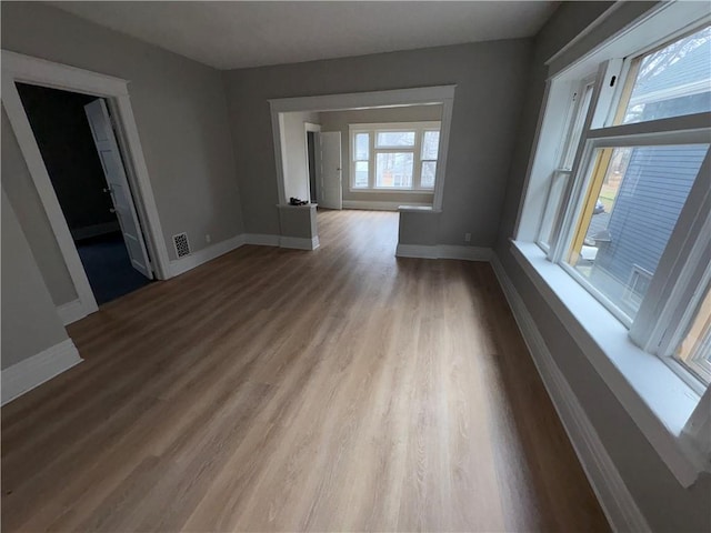 spare room with light hardwood / wood-style floors