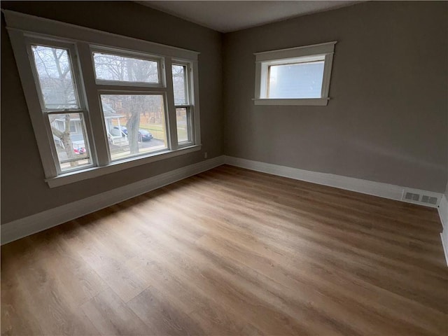 empty room featuring hardwood / wood-style flooring