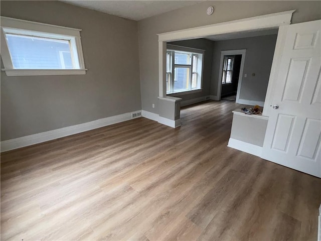 spare room with hardwood / wood-style flooring