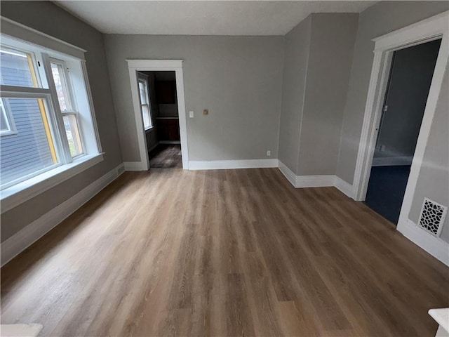 unfurnished room featuring hardwood / wood-style floors