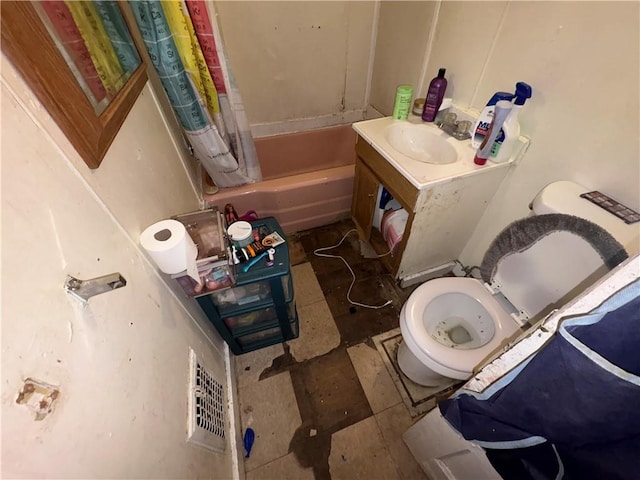 full bathroom featuring toilet, vanity, and shower / bath combo