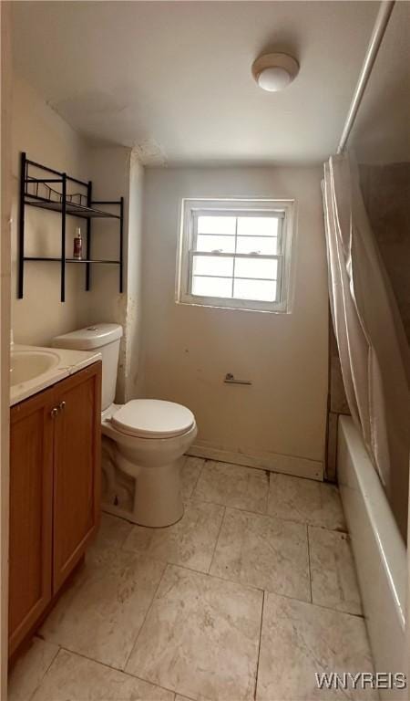 full bathroom featuring toilet, shower / bath combination with curtain, and vanity