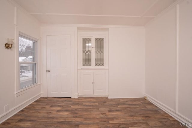 spare room featuring dark hardwood / wood-style flooring