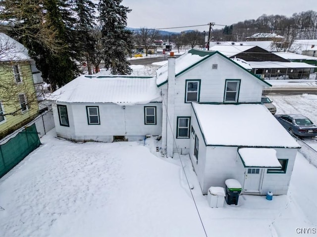 view of snow covered house