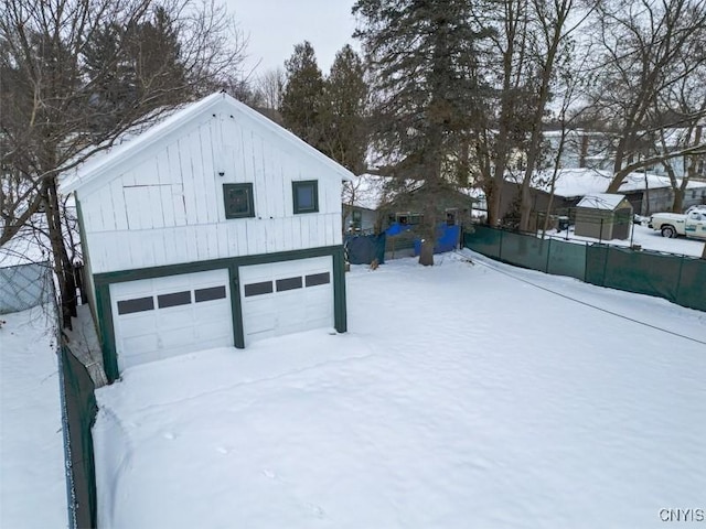 view of snow covered garage