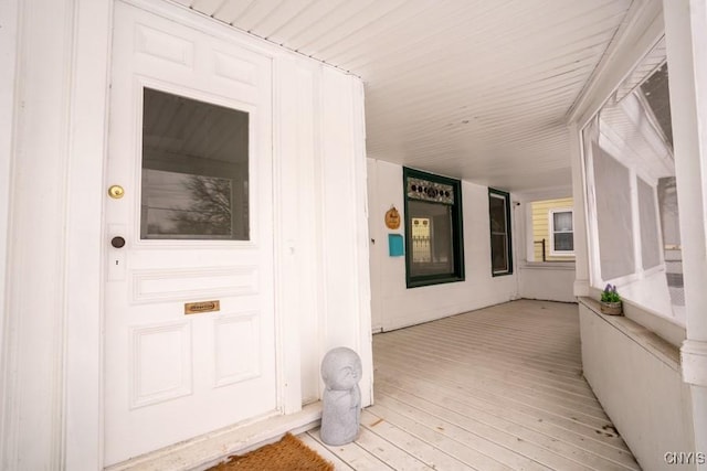 doorway to property featuring covered porch