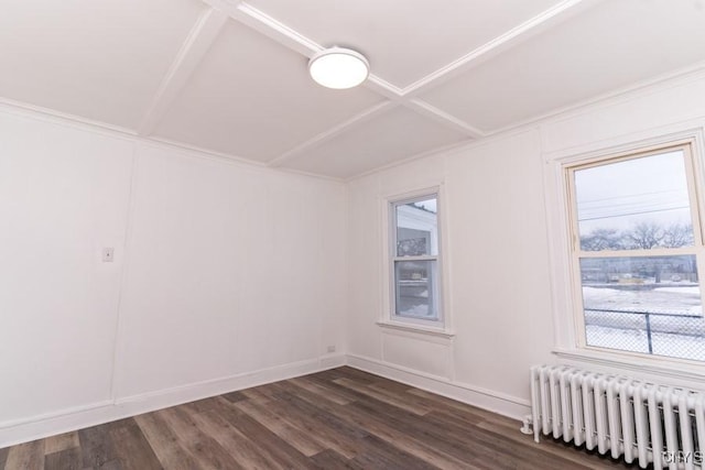 unfurnished room with dark wood-type flooring and radiator heating unit