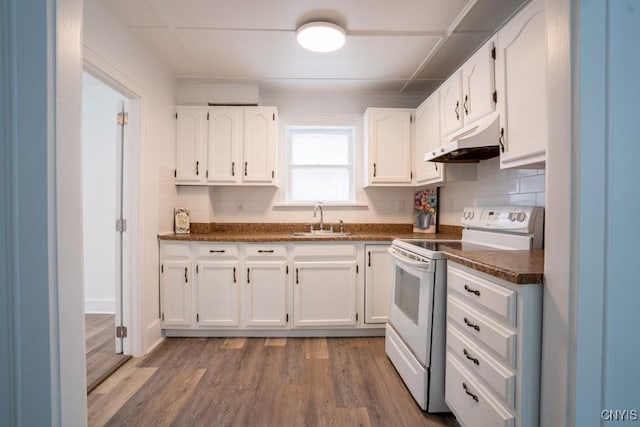 kitchen featuring hardwood / wood-style flooring, sink, white cabinetry, and white electric range oven