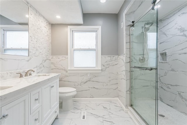 bathroom with an enclosed shower, vanity, and toilet