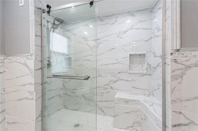 bathroom with tile walls and an enclosed shower