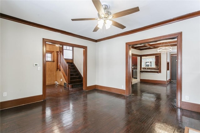 unfurnished room featuring ceiling fan, dark wood-type flooring, and ornamental molding