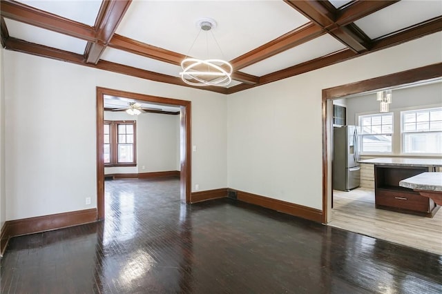 unfurnished room with hardwood / wood-style floors, coffered ceiling, and beamed ceiling