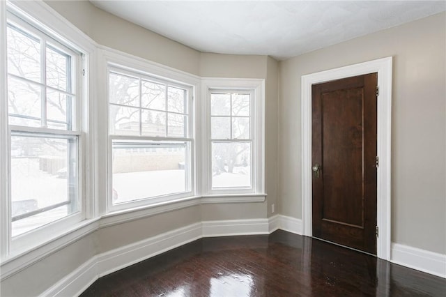 unfurnished room featuring hardwood / wood-style flooring