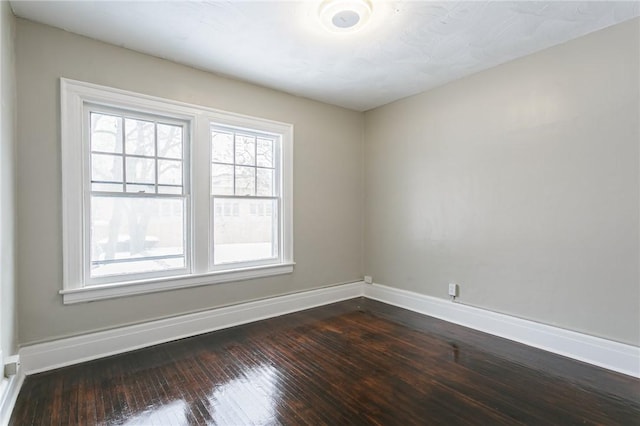 spare room featuring hardwood / wood-style floors