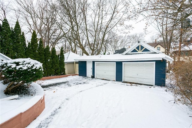 view of snow covered garage