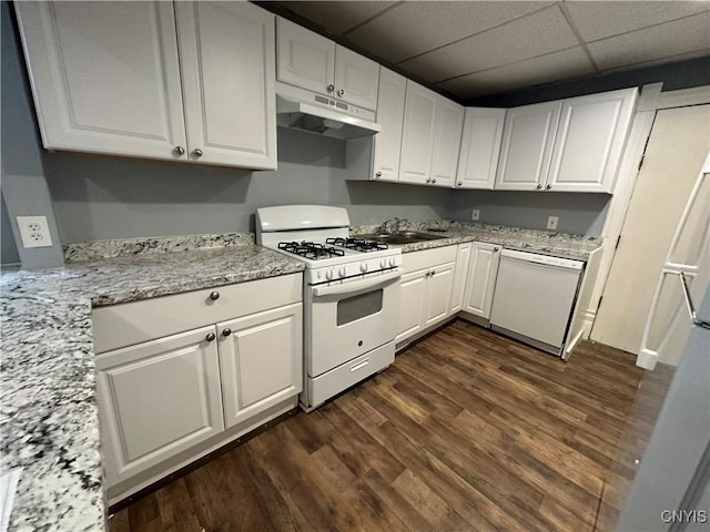 kitchen featuring white cabinetry, light stone counters, white appliances, and dark hardwood / wood-style floors