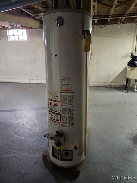 utility room featuring gas water heater