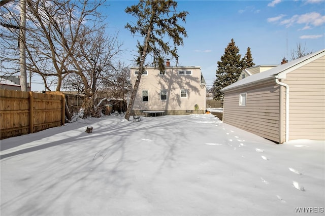 view of yard layered in snow