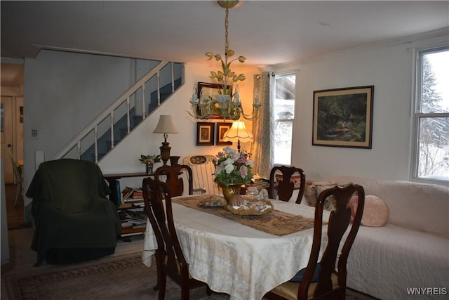 dining area with crown molding