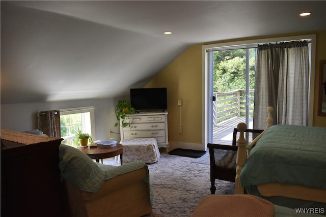 carpeted bedroom with lofted ceiling and access to exterior