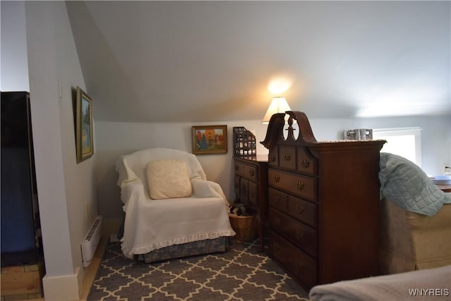 sitting room with lofted ceiling and a baseboard radiator