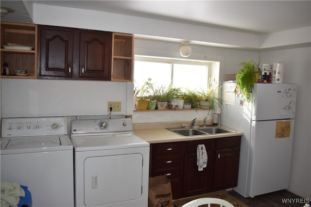 laundry area featuring independent washer and dryer and sink