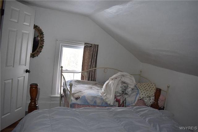 bedroom featuring lofted ceiling