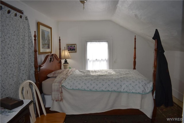 bedroom featuring lofted ceiling