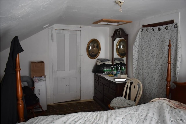 bedroom featuring vaulted ceiling