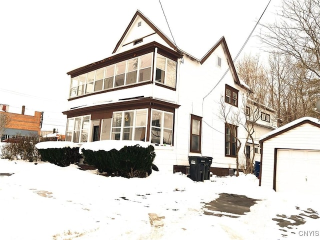 view of front facade featuring an outbuilding and a garage