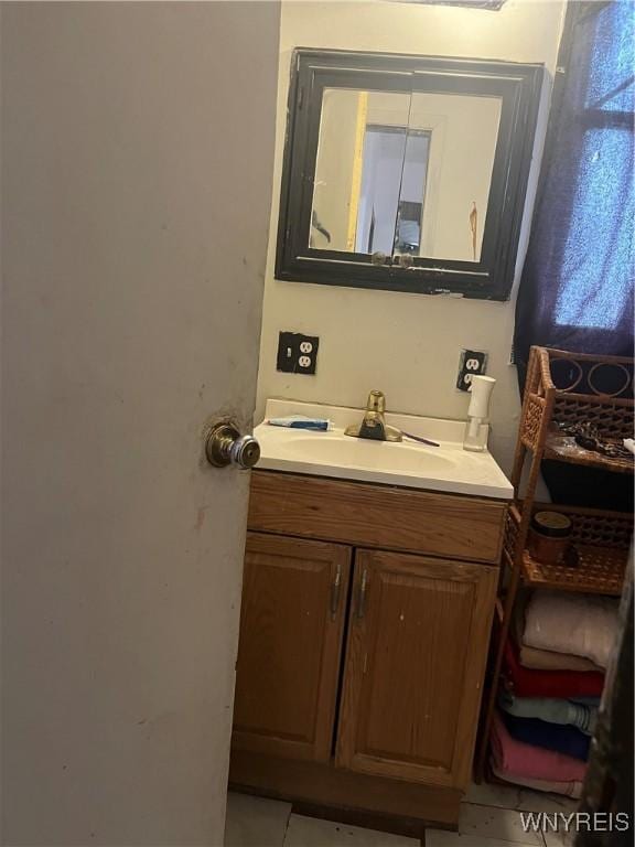 bathroom with tile patterned flooring and vanity