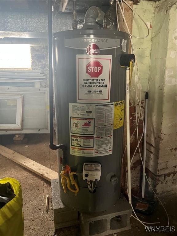 utility room featuring water heater