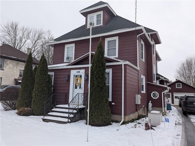 view of property with an outbuilding and a garage