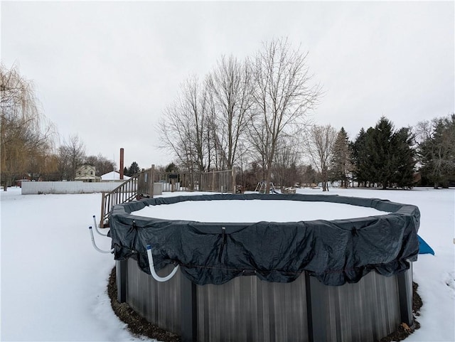 view of snow covered pool