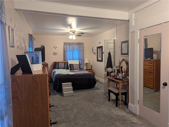 carpeted bedroom with ceiling fan and crown molding